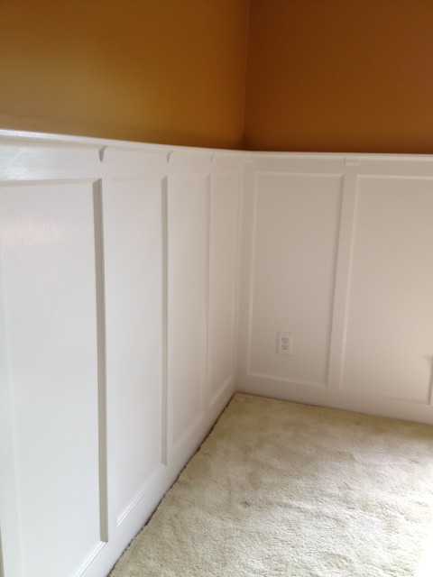Painted walls and wainscot panels in the dining room.  The white painted wainscot brightened the room dramatically, while the color above kept it feeling "warm."